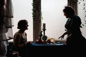 Sylvia Sceptre gives a wedding guest a tarot reading.