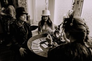 An alternative wedding couple receive a tarot reading from Sylvia Sceptre